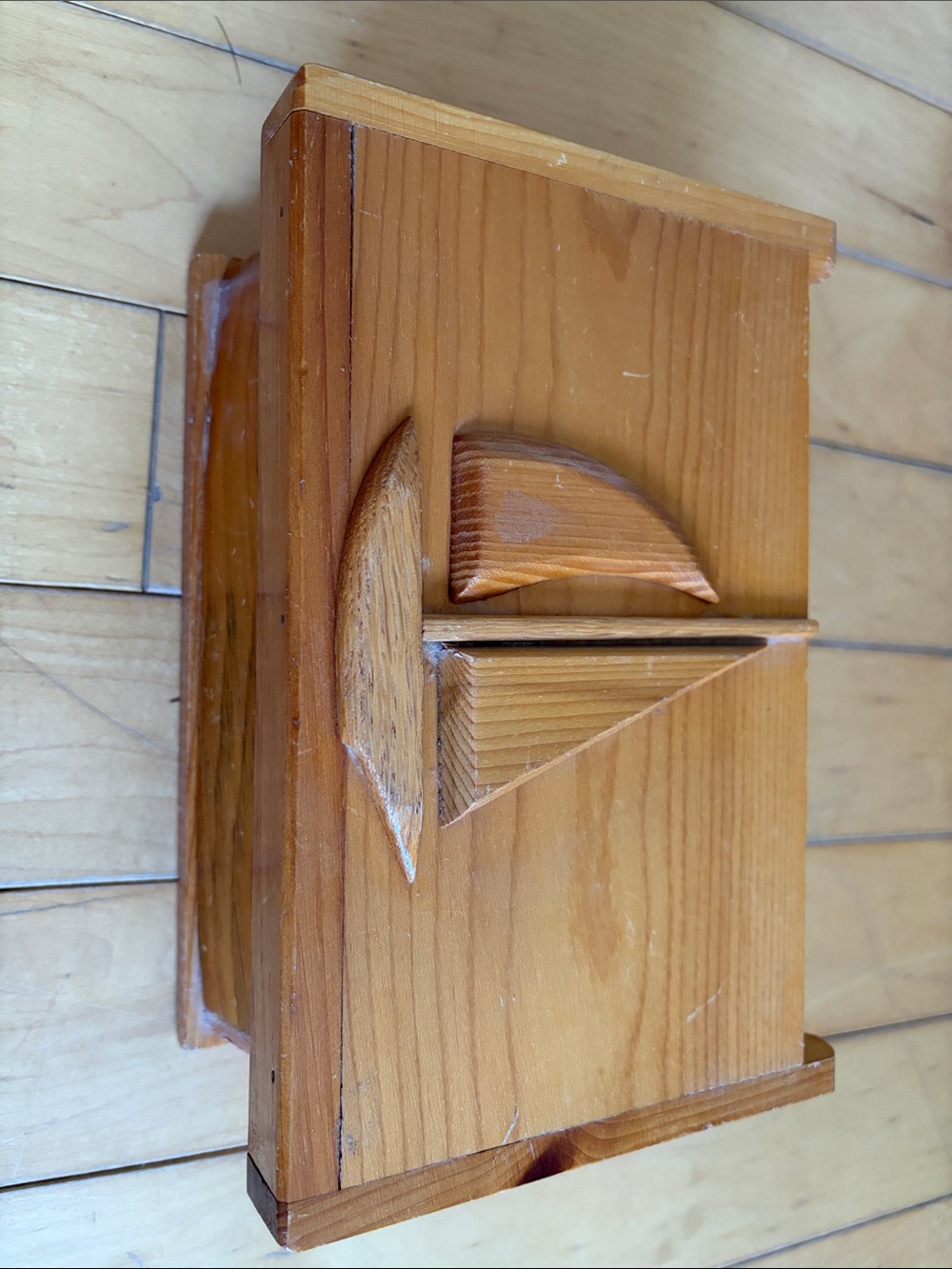 vintage wooden keepsake or trinket box featuring a hand-carved sailboat